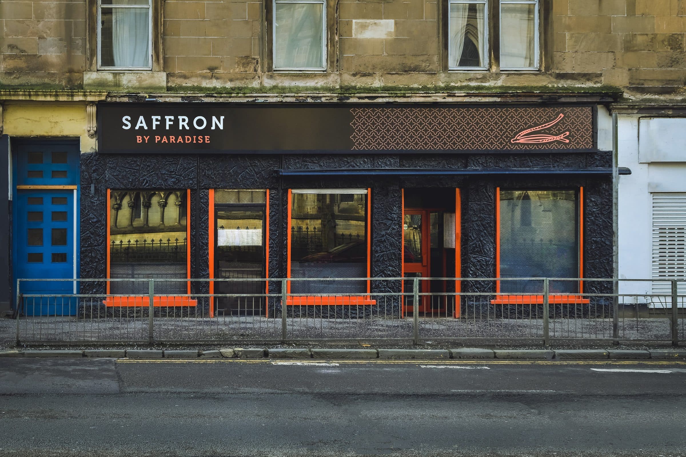 The Saffron by Paradise shopfront on Great Western Road — dark fascia and orange window frames